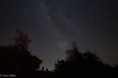 In this image, we see the Dad and Lad image under the Milky Way. The bright stars are Jupiter and Saturn.